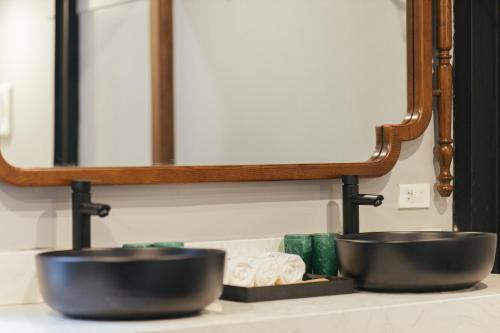 two bowls on a counter in front of a mirror at Lily Hidden Homestay in Hanoi