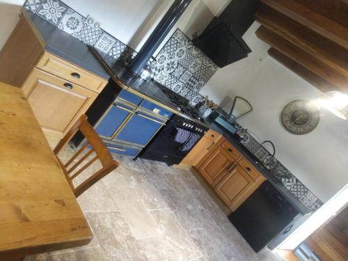 an overhead view of a kitchen with black appliances at Mas du Roy in Sénéchas