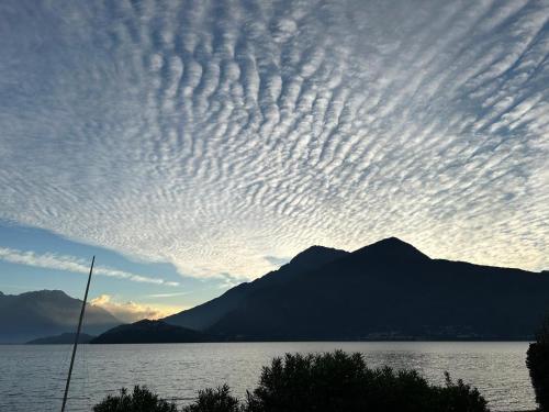 a cloudy sky over a body of water at Vecchia Filanda Musso 1A in Musso