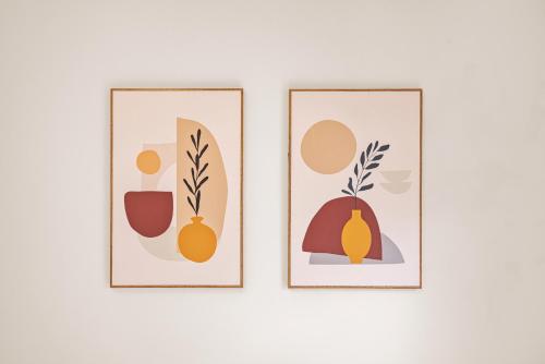 three framed illustrations of vegetables on a wall at Sunny Garden Balcony in Old Quarter, Free Laundry, Free Water in Hanoi