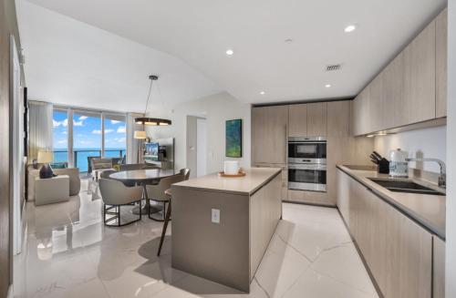 a kitchen and living room with a view of the ocean at Hyde Resort Oceanview Luxurious 2-Bedroom PH 6Pax in Hollywood