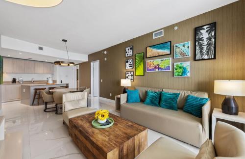 a living room with a couch and a table at Lyfe Oceanview Resort Luxury 2 Bedroom Unit in Hollywood