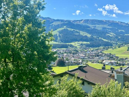 a view of a village with mountains in the background at Villa Kitzbühel in Kirchberg in Tirol