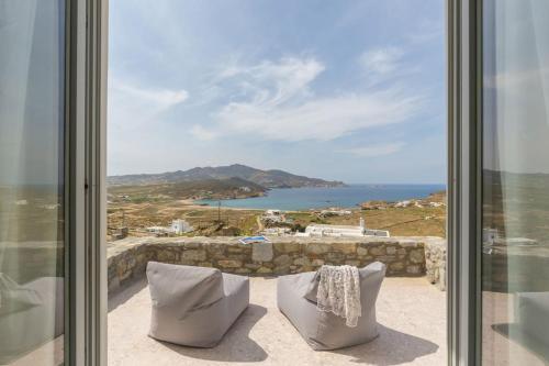 a room with a view of the ocean at Cabana Seaview Pool Villas w Night Security Guard, near Alemagou beach in Elia