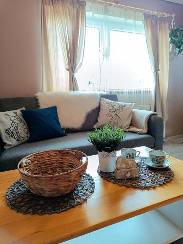 a living room with a couch and a coffee table at Rodzinny zakątek "U Głuszków" Bieszczady in Myczkowce