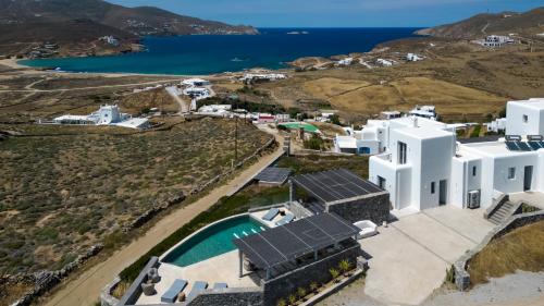 an aerial view of a white building and the ocean at Cabana Seaview Pool Villas w Night Security Guard, near Alemagou beach in Elia