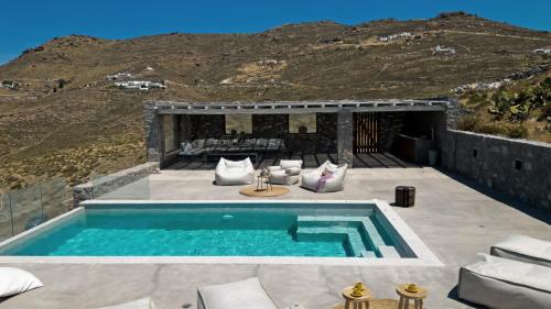 a swimming pool on the patio of a house at Cabana Seaview Pool Villas w Night Security Guard, near Alemagou beach in Elia