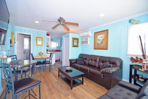 a living room with a couch and a table at Parrot Bay-Key Lime 7 condo in Ocean City
