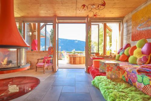 a living room with a couch and a fireplace at La Bella Vista in Curel
