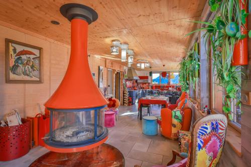 a restaurant with a large fireplace in a room at La Bella Vista in Curel