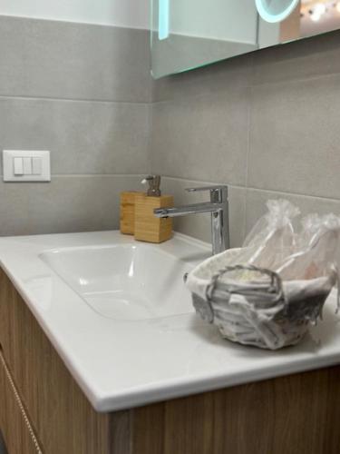 a bathroom counter with a sink and a faucet at La Foce in Savona