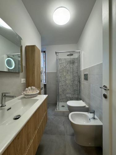 a bathroom with a sink and a toilet and a shower at La Foce in Savona