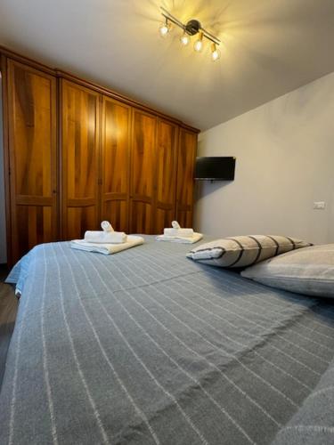 a room with a large bed in a room at La Foce in Savona