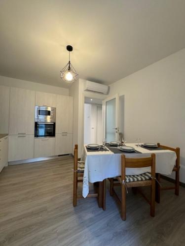 a kitchen with a table and chairs in a room at La Foce in Savona