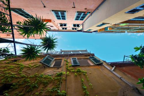 an overhead view of a building with palm trees at StarFish in Santa Margherita Ligure