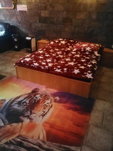 a bedroom with a bed with a tiger painted on it at Vila Barrandov in Prague