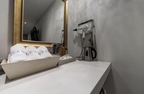 a bathroom with a counter with a box of towels at Hotel Cube in Incheon