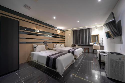 Кровать или кровати в номере Hotel Cube