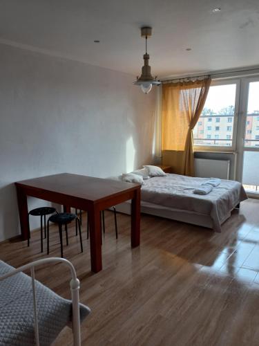 Tempat tidur dalam kamar di Gdańsk Stogi - mieszkanie w pobliżu plaży