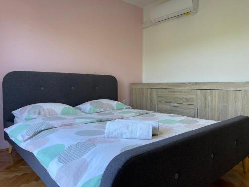 a large bed in a room with at Portorož Apartments Franca in Portorož