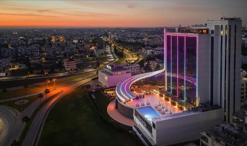 a view of a city at night with a building at Concorde Tower Hotel & Casino in North Nicosia