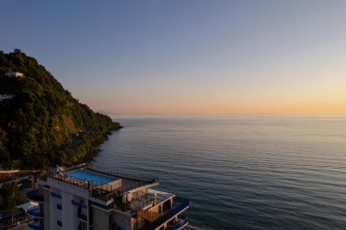 a view of the ocean from a building on the shore at Panorama Kvariati in Kvariati