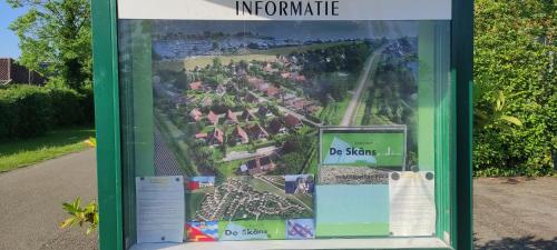 a sign in a bus stop with a map at Ferienhaus Rosenthal in Anjum