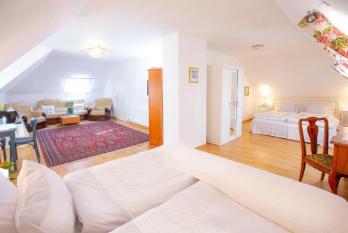 a bedroom with a bed and a living room at Marinela's BnB in Vienna