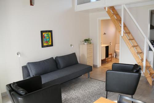 Posezení v ubytování Skøn ferielejlighed midt i Marielyst by