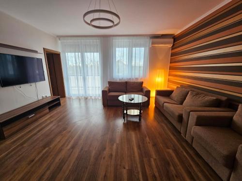 TV a/nebo společenská místnost v ubytování Mantra Wellness Apartments