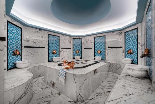 a rendering of a bathroom with two sinks and two toilets at Concorde Tower Hotel & Casino in North Nicosia
