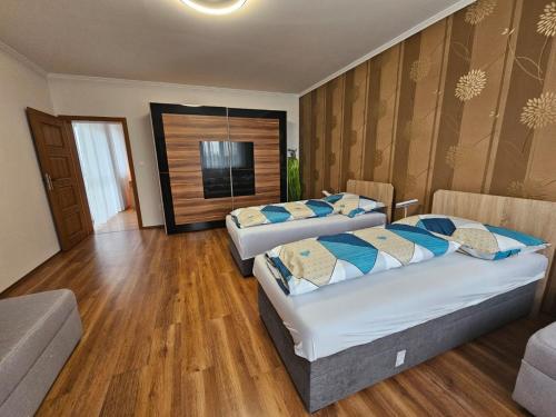 Postel nebo postele na pokoji v ubytování Mantra Wellness Apartments