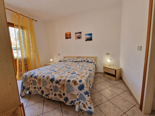Postel nebo postele na pokoji v ubytování Appartamenti Fetovaia Orchidea