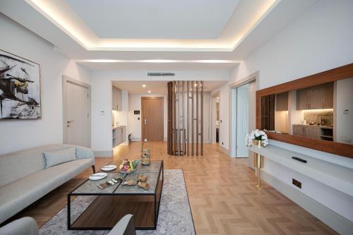a living room with a couch and a table at Concorde Tower Hotel & Casino in North Nicosia