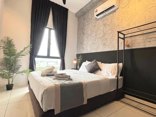 a bedroom with a bed and a large window at Ipoh Horizon Skypool Town Suites 4-11pax by IWH Suites in Ipoh