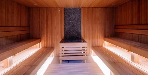 an empty sauna with a step in the middle at Molėtai Hotel in Molėtai