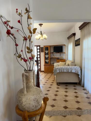a living room with a vase with flowers in it at katerina`s house in Kefalos