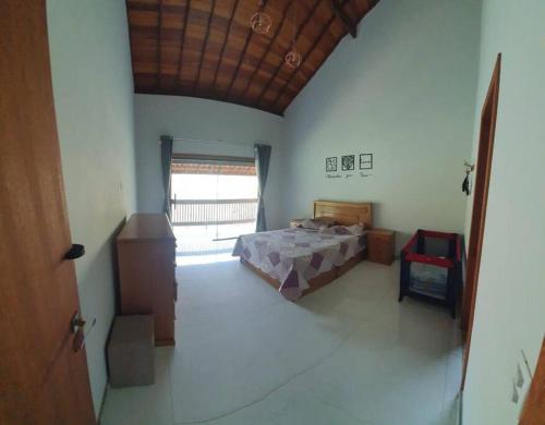 Katil atau katil-katil dalam bilik di Casa encontro dos Rio lumiar
