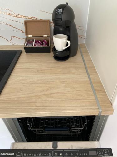 a coffee maker sitting on top of a counter at Apartament Deluxe Elbląg Old Town BULVAR in Elblag