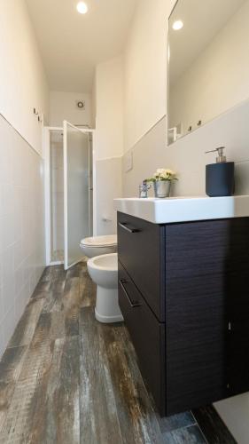 a bathroom with a sink and a toilet in it at Donna Fortuna in Catania