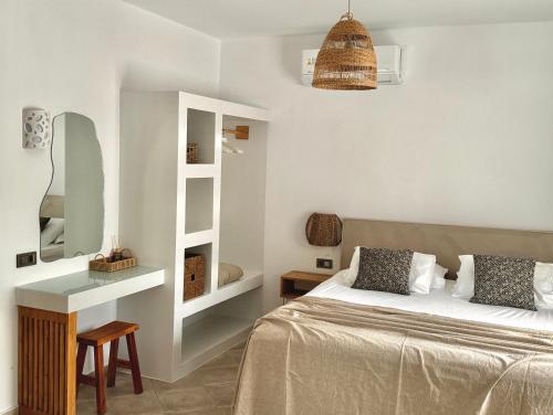 a bedroom with a bed and a table and a desk at San Salvatore in Zakynthos Town