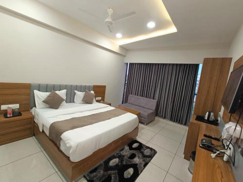 Кровать или кровати в номере HOTEL ASIANA INN