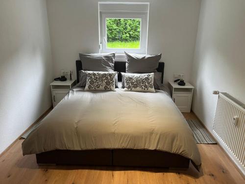 En eller flere senge i et værelse på Püttlingen Appartement