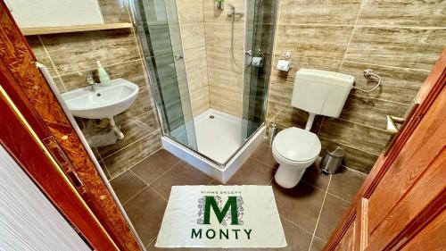 a bathroom with a sign that says mommy on the floor at Vinný sklep Monty Přítluky in Přítluky