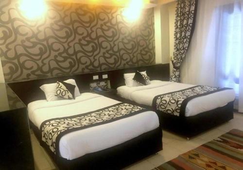 Postel nebo postele na pokoji v ubytování Panorama Bungalows Resort El Gouna