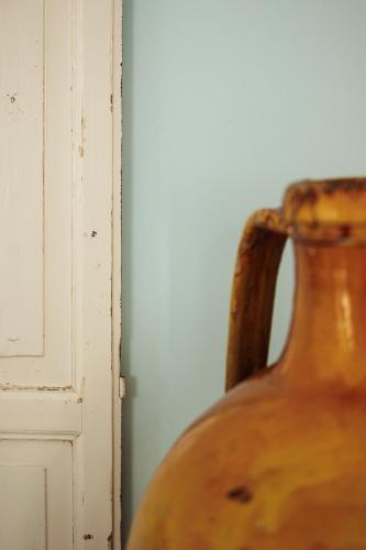 a close up of a vase next to a door at Marina di Petrolo Hotel & SPA in Castellammare del Golfo