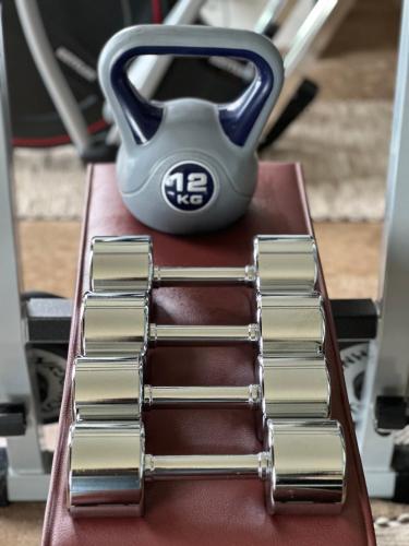 a close up of a pile of metals on a chair at Private Luxury Spa & Silence Retreat with Spectacular View over the Lake Maggiore in Stresa