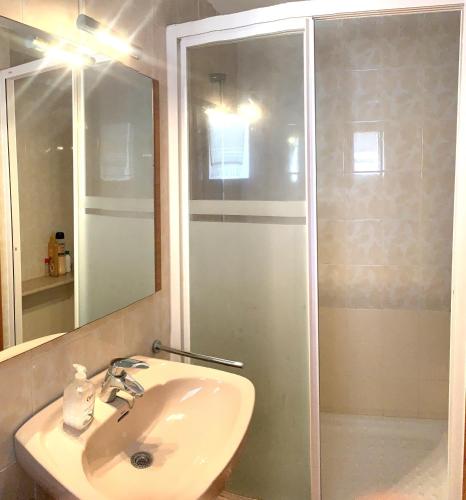 a bathroom with a sink and a shower at LagoVista45 in Torrevieja