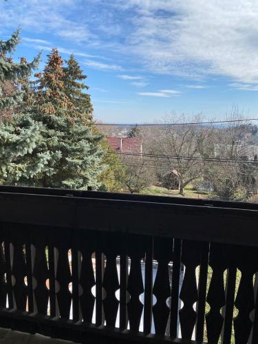 a balcony with a view of a tree at Luxury 3 BR Vila in a forest 10min drive from city center in Budapest