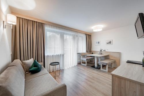 TV a/nebo společenská místnost v ubytování rechenau LIVING & RELAX